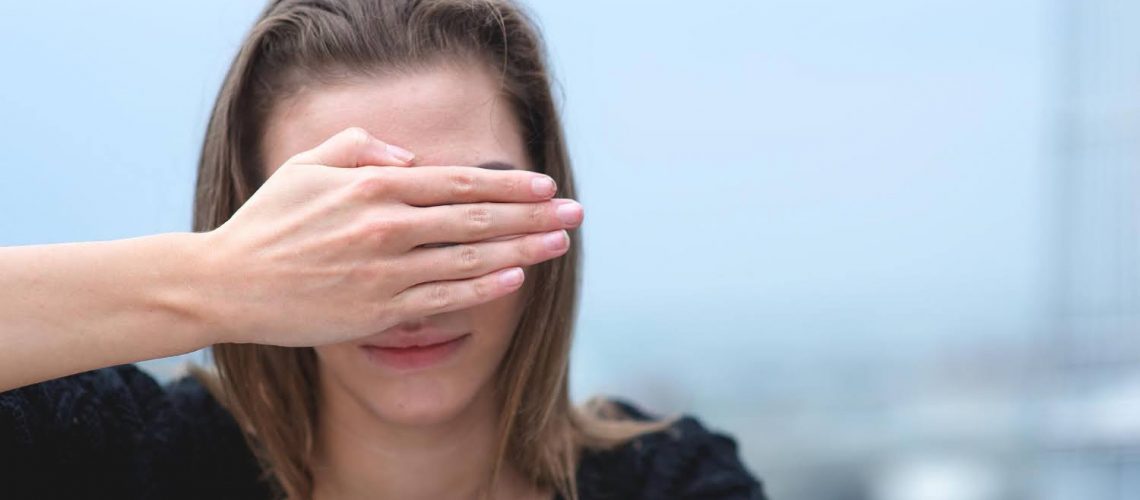 Person experiencing sudden loss of vision in one eye, typical symptom of amaurosis fugax